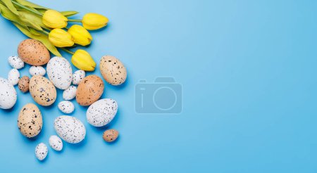 Photo for Easter delights: Colorful eggs in a festive arrangement. Flat lay with copy space - Royalty Free Image