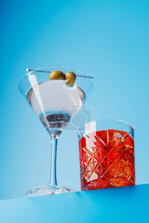 Photo for Cocktail delight: Vibrant drinks against a cool blue background with copy space - Royalty Free Image