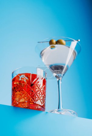 Photo for Cocktail delight: Vibrant drinks against a cool blue background with copy space - Royalty Free Image
