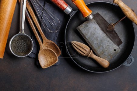 Photo for Culinary essentials: Diverse cooking utensils on stone table. Flat lay - Royalty Free Image