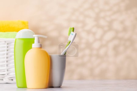 Photo for A clean and refreshing image featuring toiletry tubes and toothbrushes, promoting oral hygiene and a healthy lifestyle - Royalty Free Image