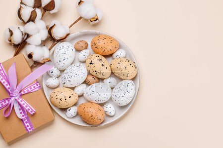 Photo for Easter delights: Colorful eggs in a festive arrangement and gift box. Flat lay with copy space - Royalty Free Image