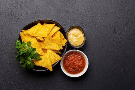 Photo for Mexican food featuring nachos. Flat lay with copy space - Royalty Free Image