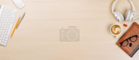 Photo for Workplace essentials: Laptop, coffee, notepad and supplies. Flat lay with copy space - Royalty Free Image