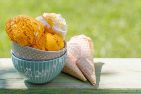 Photo for Refreshing ice cream treats with a hint of zesty lemon flavour and waffle cones - Royalty Free Image