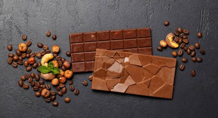 Sweet temptation: Two chocolate bars on stone background