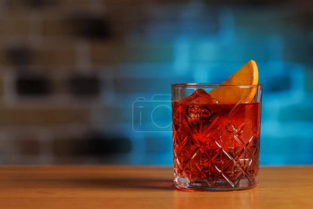 Cocktail allure: Classic negroni cocktail on a bar table with copy space