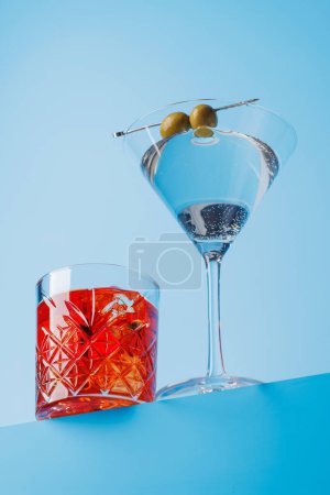 Cocktail delight: Vibrant drinks against a cool blue background with copy space