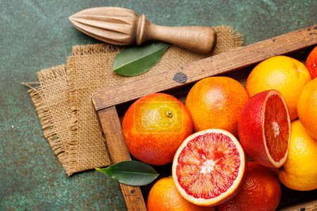 Photo for Fresh Red Oranges in Wooden Crate. Flat lay - Royalty Free Image