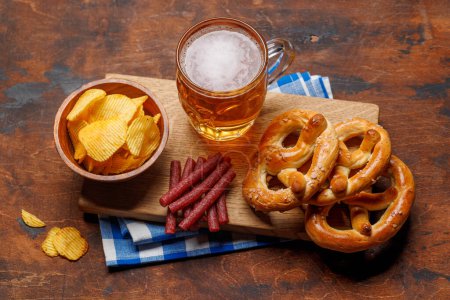 Photo for Assorted Beer Stands: chips, nuts, pretzels. Diverse Options for Refreshment - Royalty Free Image