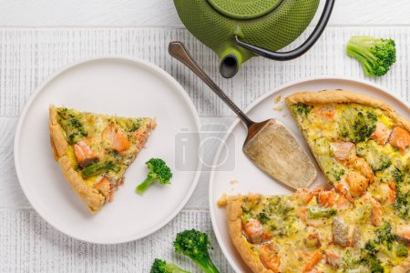Fresh fish homemade pie with salmon and broccoli. Flat lay