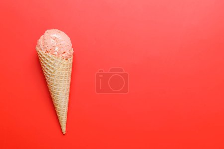 Photo for Watermelon ice cream in delightful waffle cones. Over red background with copy space, flat lay - Royalty Free Image