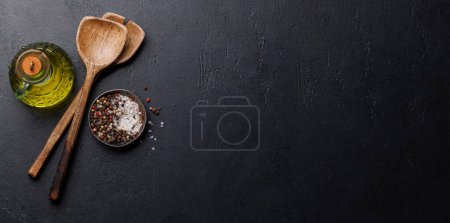 Photo for Spices, olive oil, and utensils on cooking table. Flat lay with copy space - Royalty Free Image