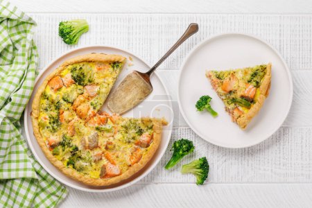 Fresh fish homemade pie with salmon and broccoli. Flat lay