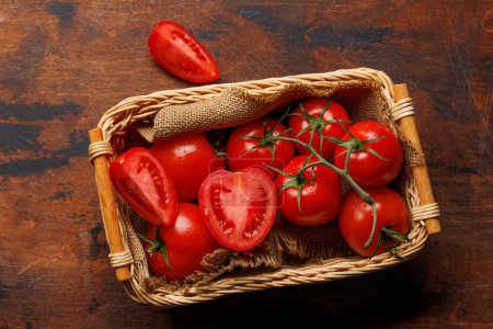 Photo for Fresh tomatoes in basket. Flat lay - Royalty Free Image