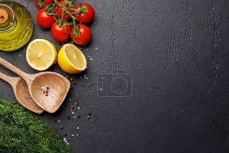 Photo for Cooking scene: Cherry tomatoes, herbs and spices on table. Flat lay with copy space - Royalty Free Image