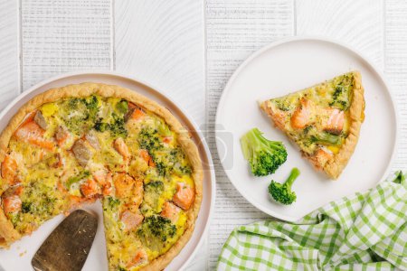 Photo for Fresh fish homemade pie with salmon and broccoli. Flat lay - Royalty Free Image