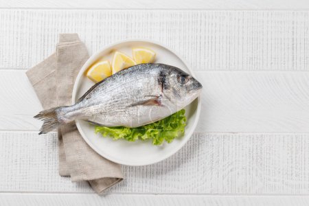 Fresh dorado fish, ready to cook. Flat lay with copy space