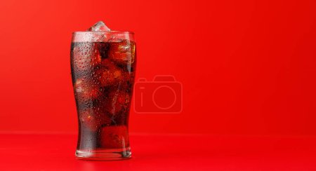 Cola with ice in glass with copy space