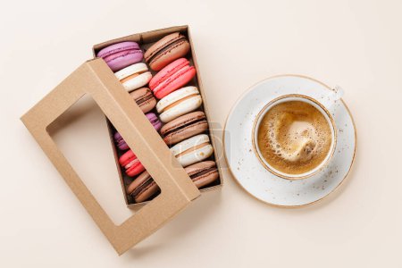Photo for Coffee and colorful macaroons in gift box. Top view - Royalty Free Image