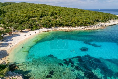 Aerial view of an amazing sea bay with beautiful Emplisi beach near Fiskardo town, Kefalonia island, Ionian sea, Greece. Perfect summer holidays destination