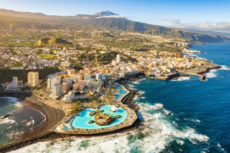Aerial view of Puerto de la Cruz city, Tenerife, Spain. Purto de la Cruz town and magnificent Teide volcano on Tenerife islansd, Canary islands.