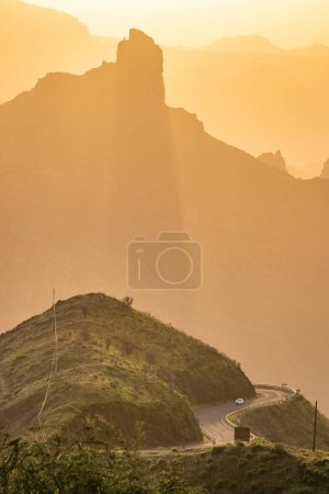 Photo for Silhouette of the Roque Nublo sacred mountain at sunset, Roque Nublo Rural Park, Gran Canary, Canary Islands, Spain - Royalty Free Image