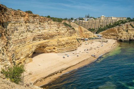 Photo for Beautiful beach at sunny day, Algarve, Portugal. Luxury Hotels Resort near rocky beach in Sothern Portugal. Popular tourist destination in Portugal - Royalty Free Image
