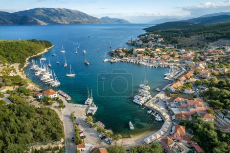 Aerial view of the picturesque Fiskardo village and port Kefalonia island, Greece. Sail boats and yachts moored in traditional fishing village of Fiscardo, Cefalonia, Greece.
