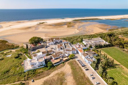 Photo for Cacela Velha old fishermen village in Algarve region, Portugal. Aerial view of Fortress Forte de Cacela Velha and Praia de Cacela Velha beach. South Portugal travel destination - Royalty Free Image