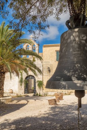 Photo for Close-up view of metal orthodox church bell in Greek Orthodox Virgin Anafonitria Monastery on Zakynthos island, Greece. - Royalty Free Image
