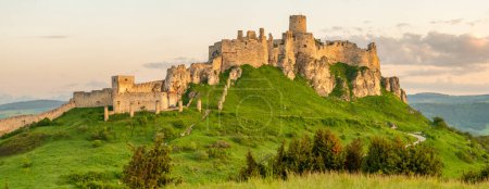 Photo for Panorama of the Spis castle at sunrise, Unesco World Heritage Site, Slovakia. Spissky hrad medieval castle. Spis Castle in the town of Spisske Podhradie in Slovakia. - Royalty Free Image