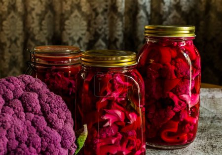 Photo for Homemade pickle with purple cauliflower in jars on a gray background - Royalty Free Image