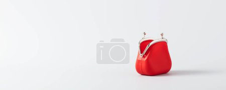 Open Red Coin Purse on blue background with copy space, banner, minimalistic style. Financial crisis, poverty, lack of money concept