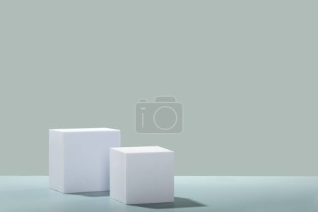 Photo for Abstract empty white cubes podiums with eucalyptus leaves and shadows on blue background. Mock up stand for product presentation. 3D Render. Minimal concept. Advertising template, copy space - Royalty Free Image