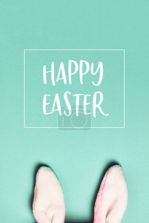 Photo for Easter greeting card with Plushy bunny ears on bright background. Easter minimal concept. Flat lay - Royalty Free Image