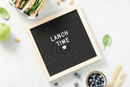 Photo for Lunch time letter board and healthy food flat lay. Vegan eating, eco friendly, zero waste concept - Royalty Free Image
