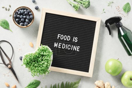 Photo for Food is medicine letter board quote flat lay. Healthy eating concept - Royalty Free Image