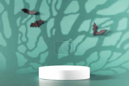 Foto de Composición creativa de Halloween con murciélagos de papel, podio y fondo azul. Conveniente para la exhibición del producto y el concepto de negocio. - Imagen libre de derechos