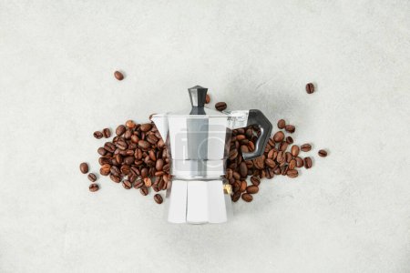 Photo for Flat lay of moka pot coffee maker and coffee beans on grey stone background - Royalty Free Image