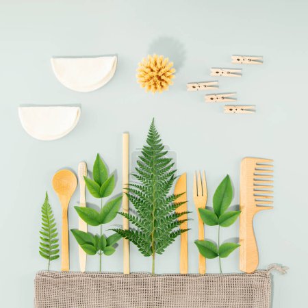 Photo for Sustainable lifestyle concept. The summer landscape is made of various eco friendly personal care and kitchen products on blue background, creative idea minimal concept - Royalty Free Image