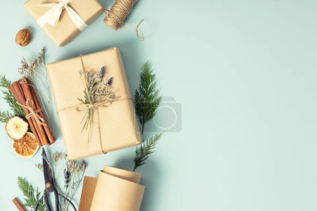 Photo for Christmas and New Year flat lay with gift boxes and decorations, eco friendly trendy zero waste packaging, holiday mood concept, making gifts copy space - Royalty Free Image