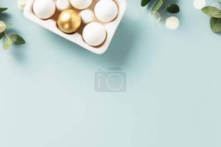 Photo for Easter table decorations. Happy Easter concept with golden table setting, easter eggs, feathers and spring flowers. Easter background with copy space. Flat lay - Royalty Free Image