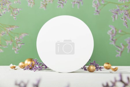 Photo for Easter background concept. Empty round podium, easter gold eggs with spring flowers on a green background - Royalty Free Image
