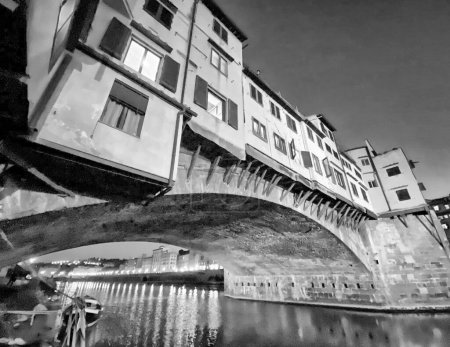 Foto de Puente Viejo y Florencia Lungarni por la noche. Paisaje urbano panorámico de Firenze en otoño, Toscana - Italia - Imagen libre de derechos