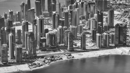 Photo for Aerial view of Doha skyline from airplane. Corniche and modern buildings, Qatar. - Royalty Free Image