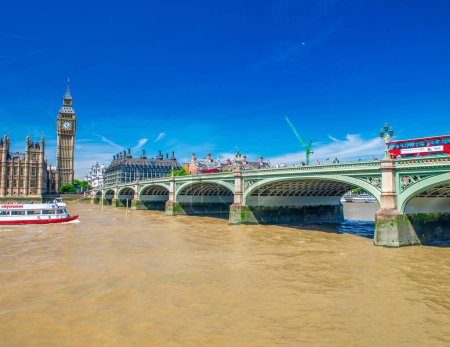 Photo for LONDON, UK - JULY 3RD, 2015: City traffic along Westminster Bridge in summer season - Royalty Free Image
