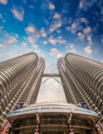 Photo for KUALA LUMPUR, MALAYSIA - JUL 23, 2010: Skyward view of Petronas Twin Towers. The skyscraper (451.9m/88 floors) is the tallest twin buildings in the world. - Royalty Free Image
