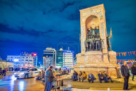 Photo for Istanbul, Turkey - October 2014: Tourists and locals at night along the crowded Taksim Square. - Royalty Free Image