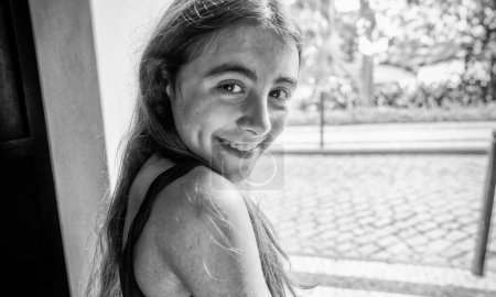 Photo for Portrait of a happy young girl smiling to the camera. - Royalty Free Image